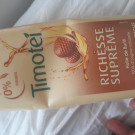 Swatch de critosse : Richesse Suprême-Shampoing riche pour cheveux très sec, frisés ou crépus à l'huile de Burifi, Timotei