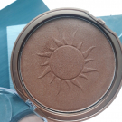 Swatch de Douceurapaillettes : Poudre compacte bronzante, Lovely Pop