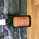 Swatch de Poponnette : Huile de Massage à l'Arnica, Weleda