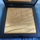 Swatch de Infinity2218 : Paradise found pourdre bronzante, Nars