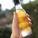 Swatch de peaudane : Huile douche triphasée Ekos Maracujá, Natura Brasil