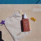 Swatch de Alison Calmer : Huile protectrice solaire, MIDI12