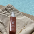 Swatch de Happy housewife mum : Huile protectrice solaire SPF 50, MIDI12