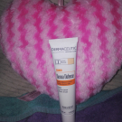 Swatch de Paillettes cosmiques : Derma défense crème de jour DD, Dermaceutique