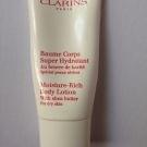 Swatch de nadia : Baume Corps Super Hydratant, Clarins