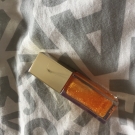 Swatch de little flower : Eclat Minute Huile Confort Lèvres, Clarins